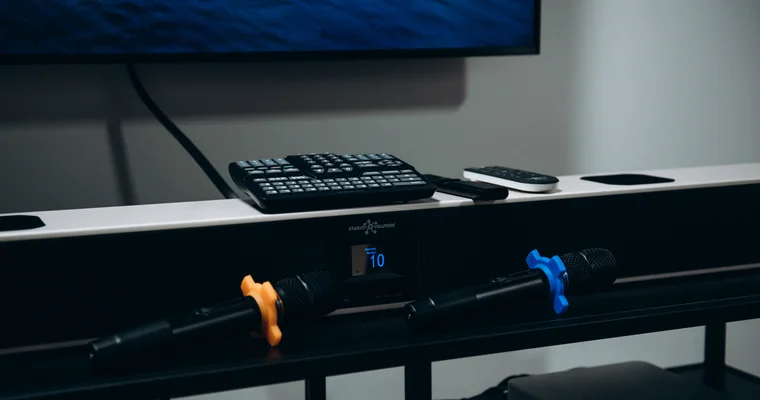 EvoSound Bar with wireless microphones under the TV